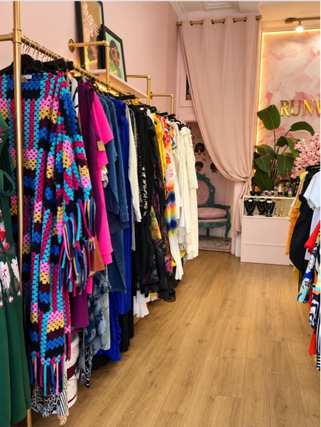 Curated clothing racks inside Runway Boutique